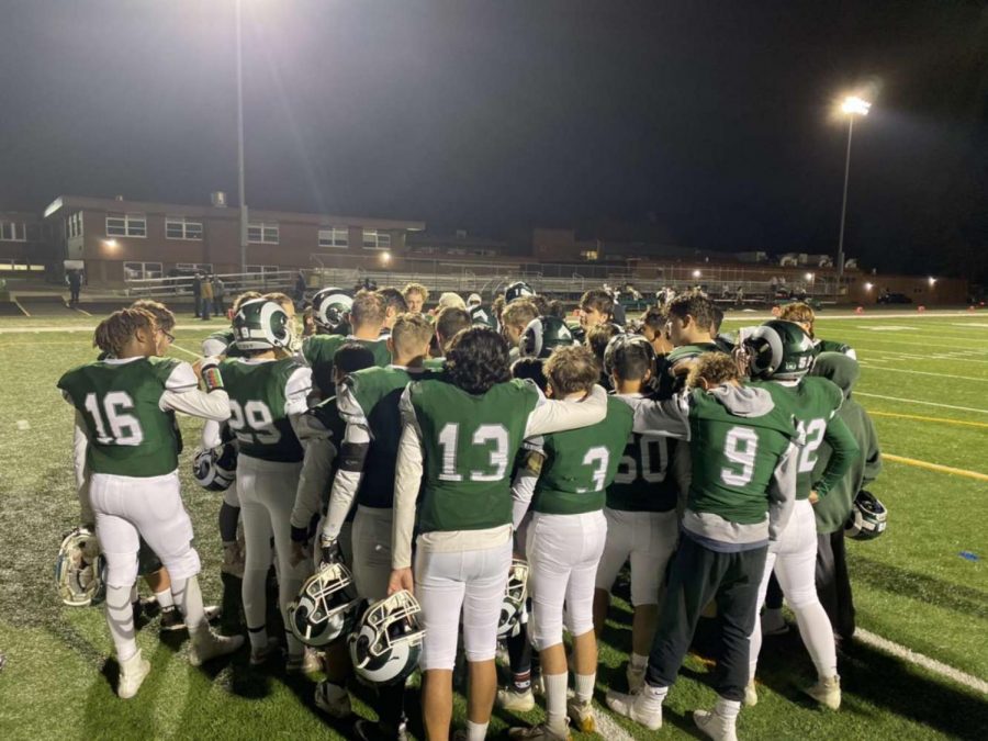 Football team huddles after a big game