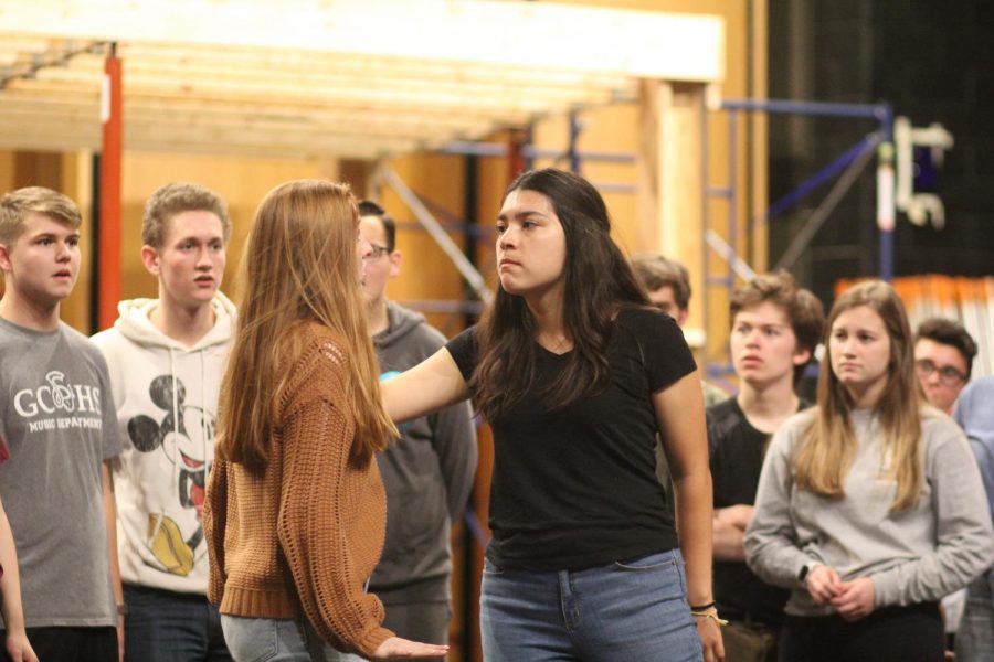 Junior Larina Pelletier gives an intense stare to sophomore Amanda Barry in a scene from ‘Godspell’. 