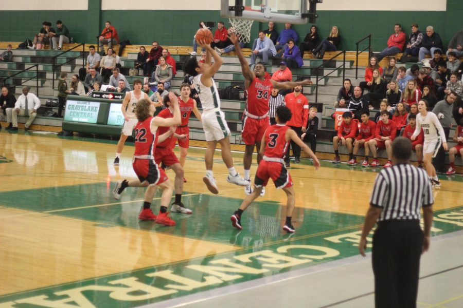 Senior Dillan Dumanlang avoids a block and shoots for two.
Photo by Maia AlBarrak