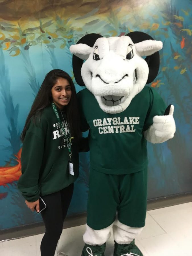 Karishma+Bhalla+posing+for+a+picture+with+school+mascot.+
