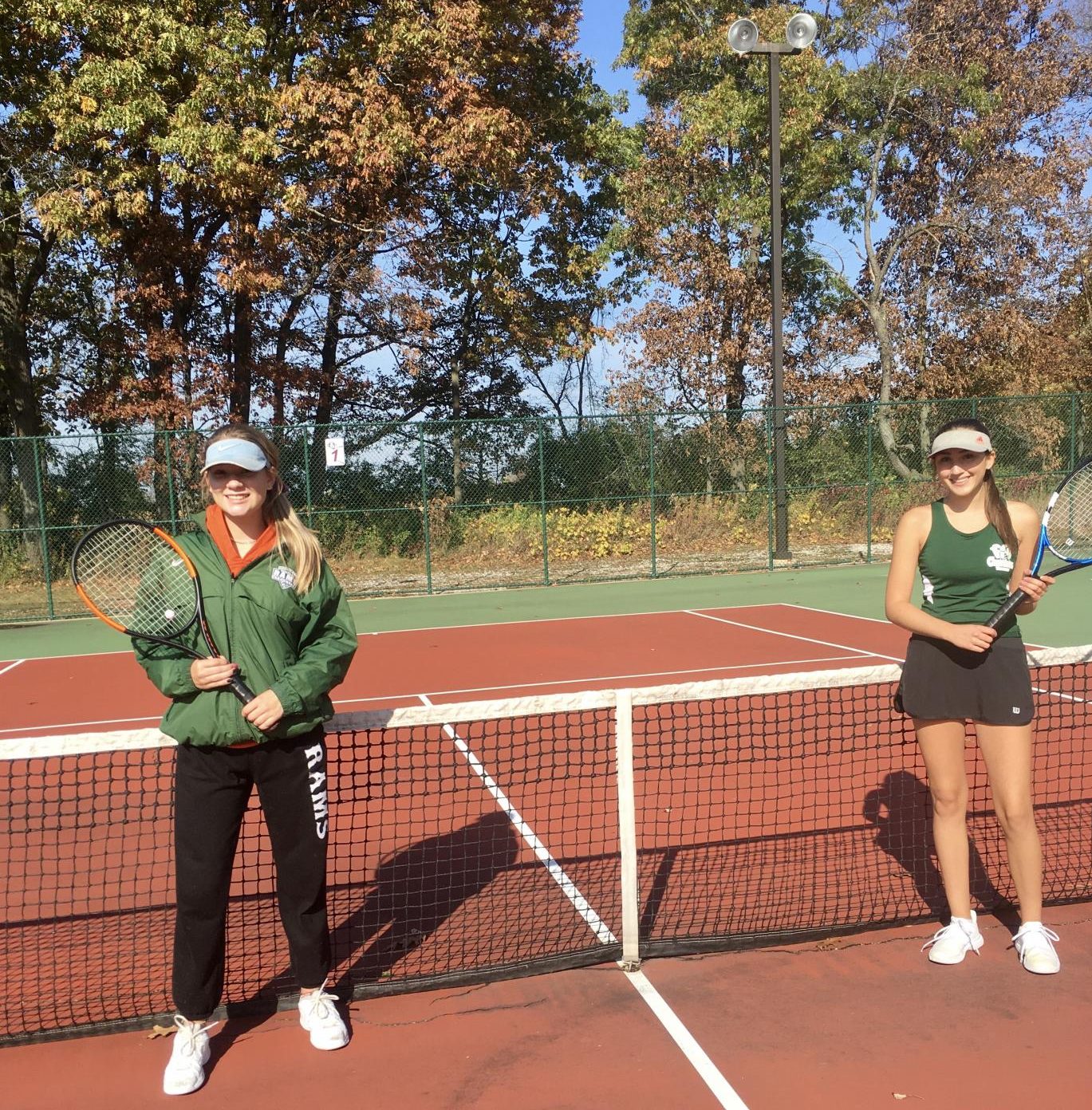 Photo of Aviva Krill (left) and Grace Caldwell (right) before clashing with Wauconda in the sectionals finals match at Lakes.