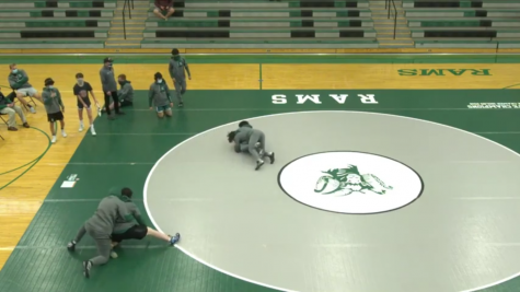With the seasonal sports being held via LiveStream, varsity wrestling warms up before clashing against the McHenry High School Warriors and the Waukegan High School Bulldogs on May 4. Dennis Carcamo shared the mentality he always applies during his matches. “I just have to push through the pain and mentally prepare myself to win because it’s going to be a fight throughout all of those six minutes,” said Carcamo.
