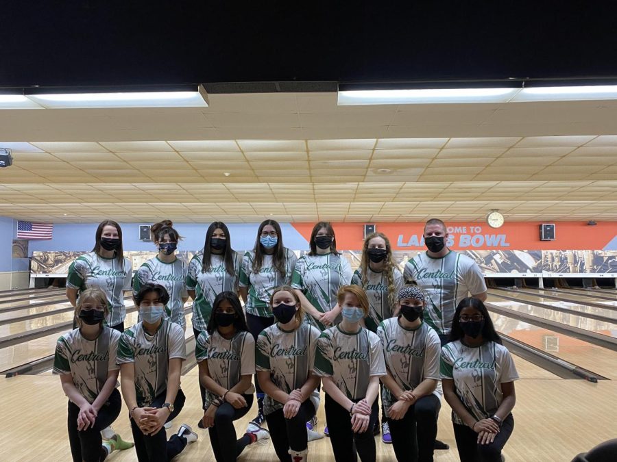 Girls bowling team strikes a pose.