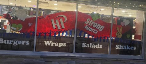 A large HP Strong mural sits on the windows of Michaels. 
