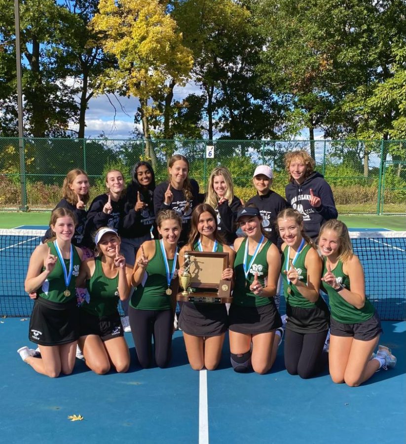 On Oct. 7, the girls varsity tennis team celebrates their undefeated conference record.