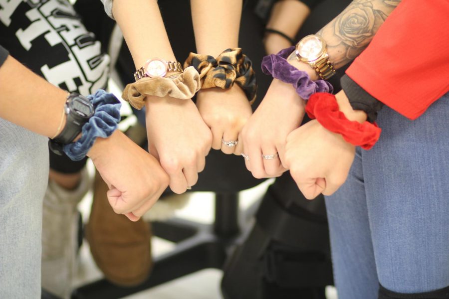 Students flaunting their scrunchies. Photo by Mykie McGill.