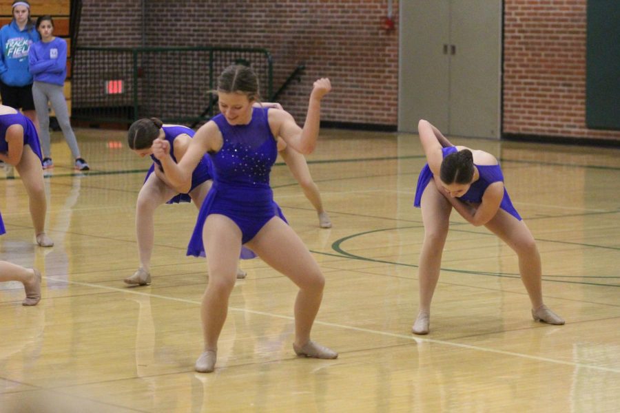 Girls’ varsity team breaks out their dance routine at the Best Buddies Basketball game.