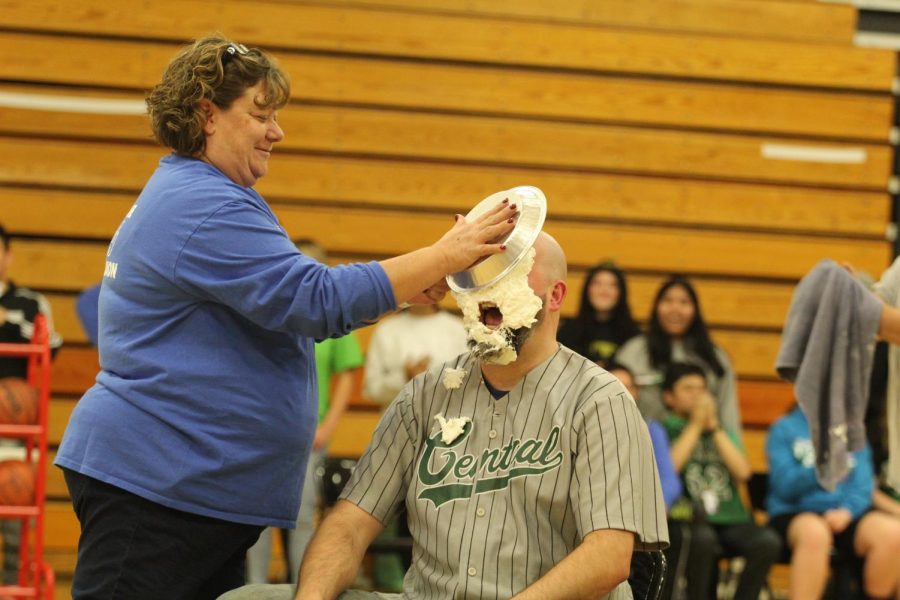 Security guard Dan Gallagher gets a face full of pie.