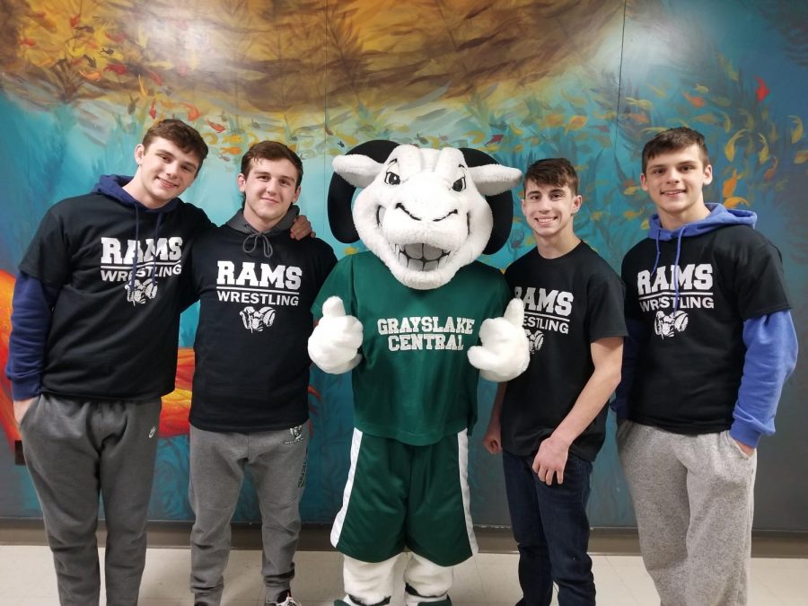 The four state wrestlers alongside school mascot Guido the Ram after their state sendoff. Photo by Nichole Trudeau.