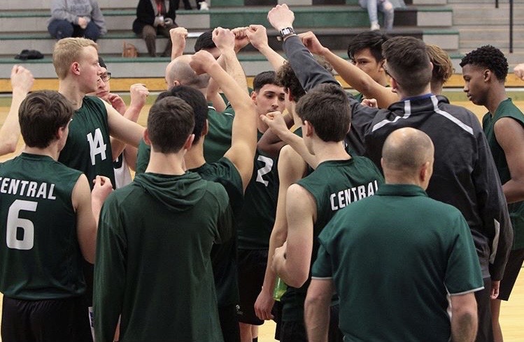 The boys’ varsity volleyball team doing their pre game hype up chant, last season. 