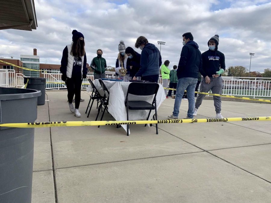 Group members from team Hace Calor inspect a crime scene during Hunt for the Cure. 