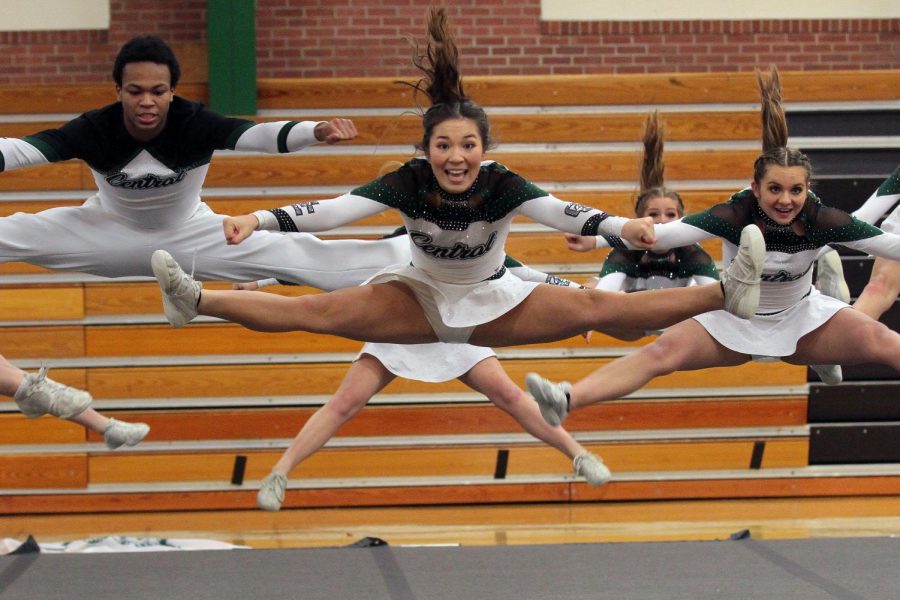 Athletes of the GCHS cheer team perform their split jump mid-air. Although cheer may be different this year, the athletes are still grateful they get to perform. “I think theres a lot of expectations that the kids have set for themselves but Im just really happy that they have the opportunity to compete again this year,” stated Custodio.