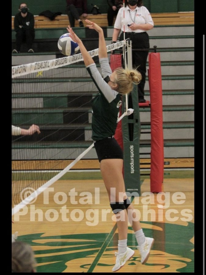 Piper Gallaher blocks the ball from hitting the ground to help secure a win for her team. Even with the positives the girls volleyball faced this year, Gallaher explains, “This team is a great team, but we will be back next year even better.”