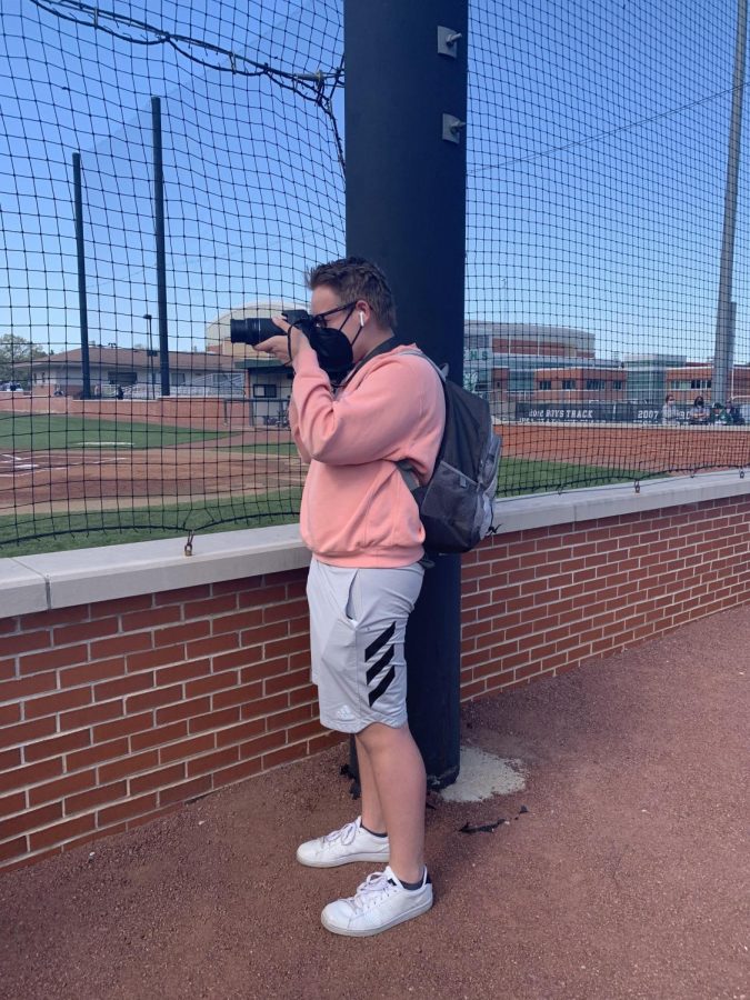 Oelschlager stays busy by taking multiple pictures of the varsity baseball team on senior day May 13. Photo provided by Janet Guckenberger.

