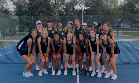 On August 19, girls varsity tennis team pose for a photo after winning against Vernon Hills