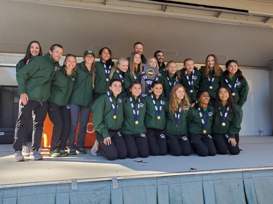 On Nov. 6, the girls cross country team showed off their gold medals and first place state trophy.