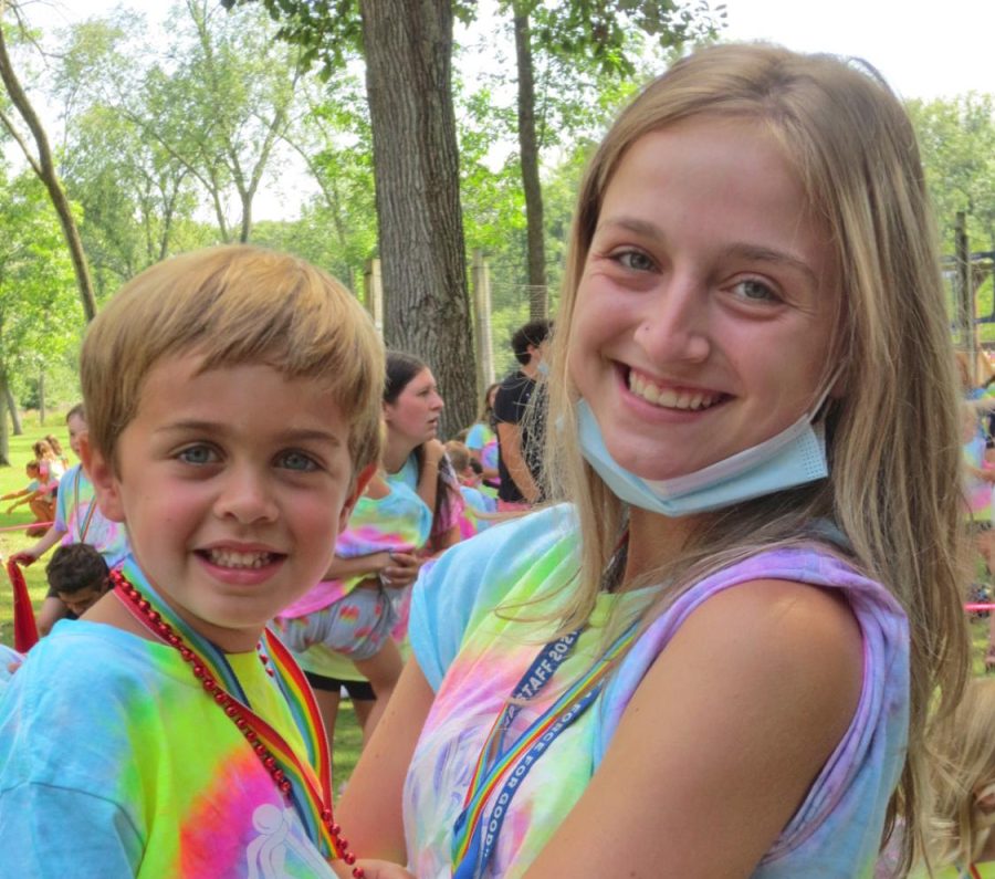 Banner+Day+Camp+group+counselor+Olivia+Herman%0Aposes+with+one+of+her+campers.