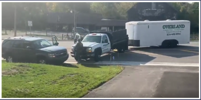 A still from a user posted video on the subreddit r/ChicagoSuburbs showing ICE agents approaching Overland Landscape Co. in Lake Zurich. 
Video captured by Reddit user TubaJesus