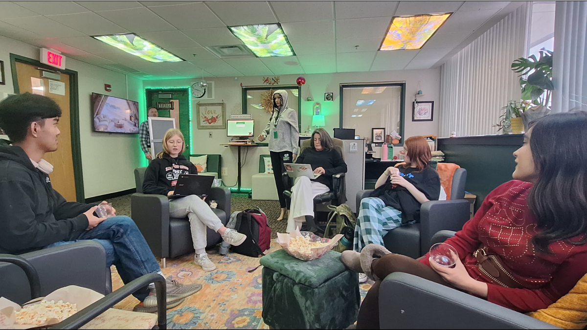 In order from left to right: Film Club members D.J. Aviles, Kate VanDeWeghe, Noel Marquardt, Orville Knol, and El Vazquez all discuss future plans for their short film. 
