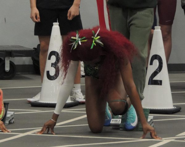 Lauryn Francis gets set for a race at an indoor track meet